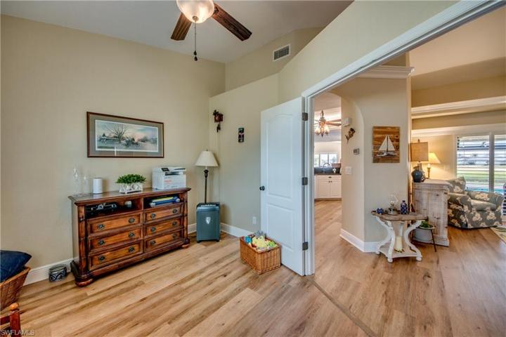 Double door entry leads to the den/office with large window facing West