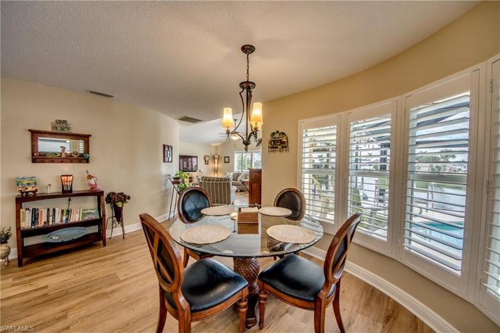 Enjoy your morning cup of coffee over-looking the pool with views of the lake and intersecting canal
