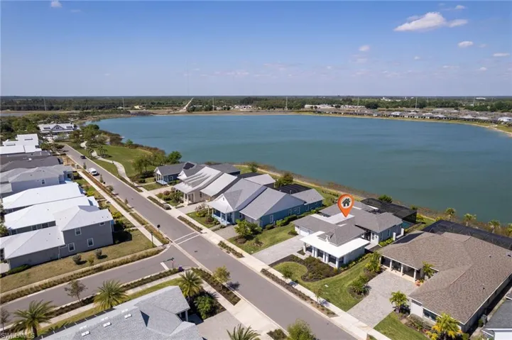 Aerial view featuring a water view and a residential view