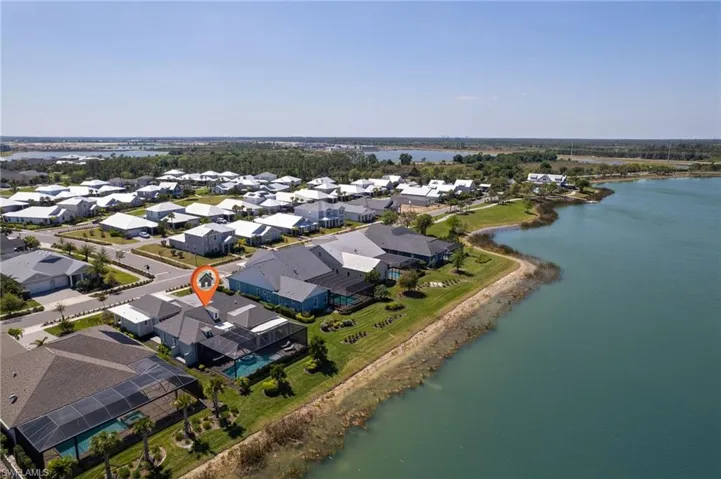 Birds eye view of property with a residential view and a water view