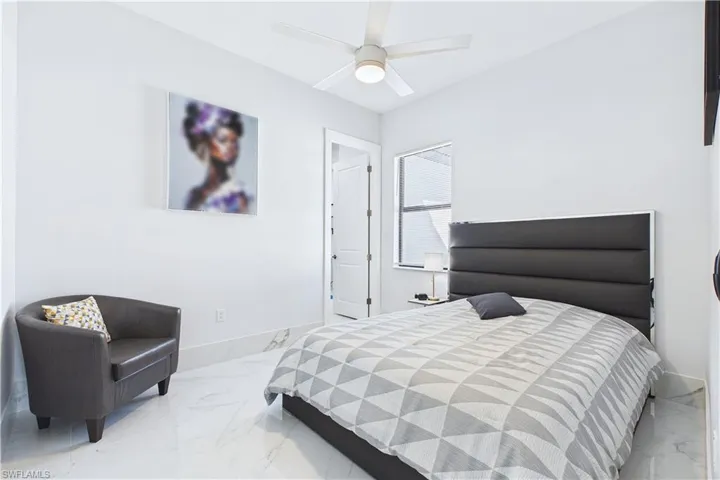 Bedroom with baseboards and a ceiling fan