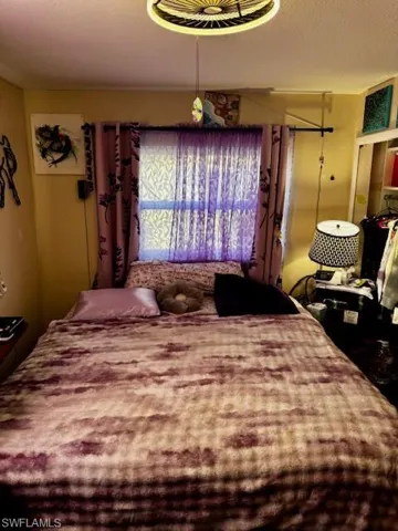 Bedroom with a textured ceiling