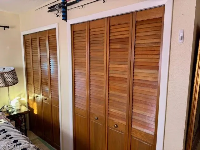 Bedroom with multiple closets