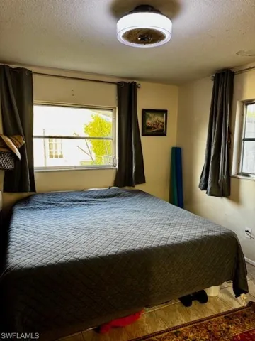 Bedroom with a textured ceiling