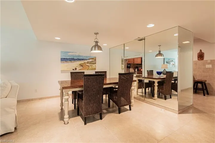 Dining room with recessed lighting and light tile patterned floors