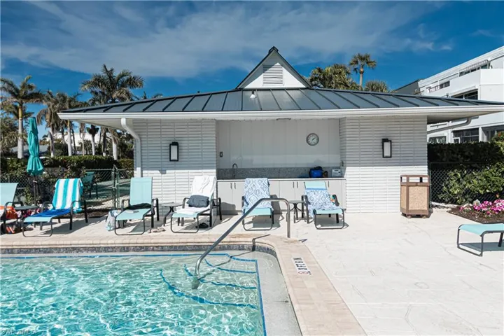 Community pool featuring a patio