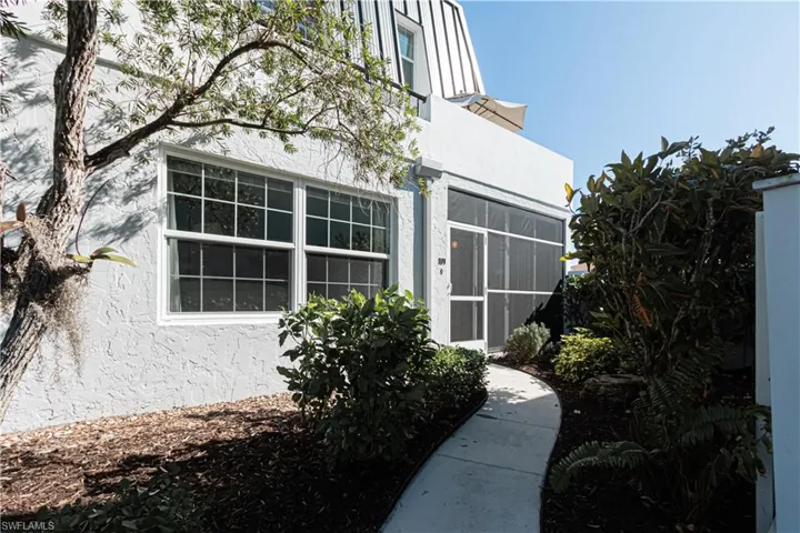 View of side of home featuring stucco siding