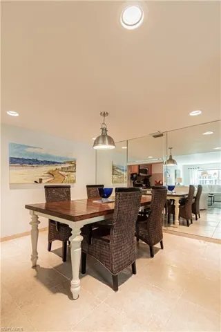 Dining room with recessed lighting and light tile patterned flooring