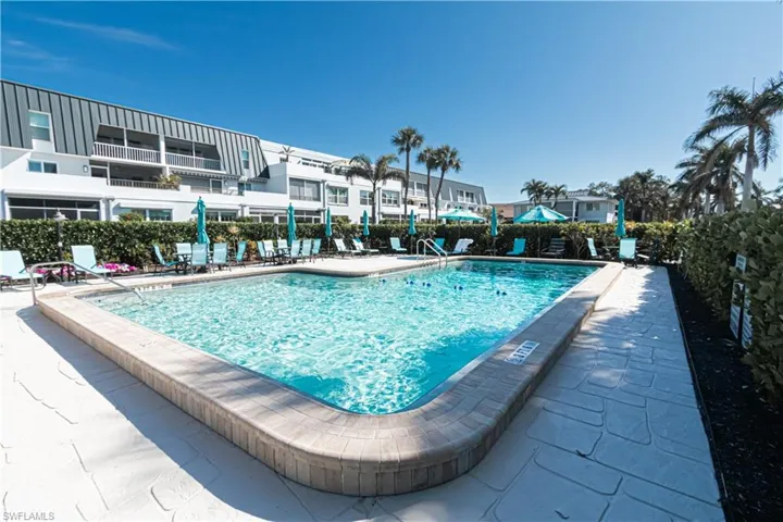 Community pool featuring a patio area