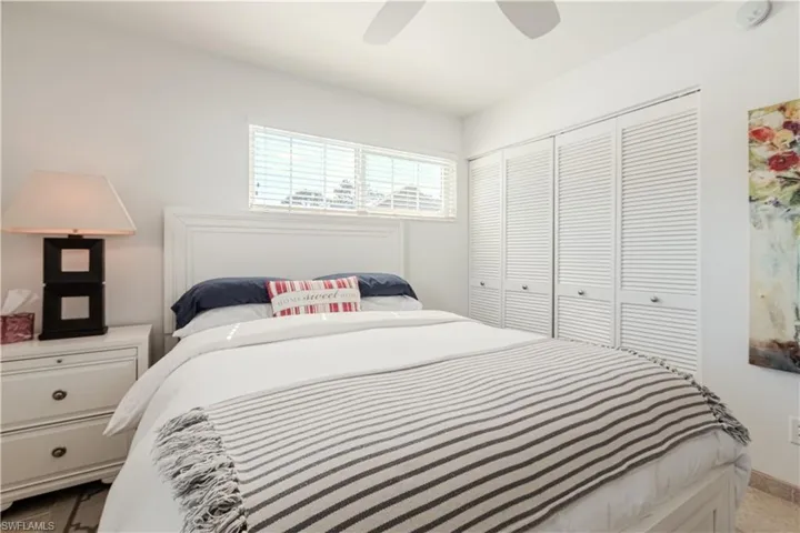 Bedroom featuring a ceiling fan and a closet