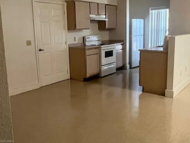 Kitchen with white appliances