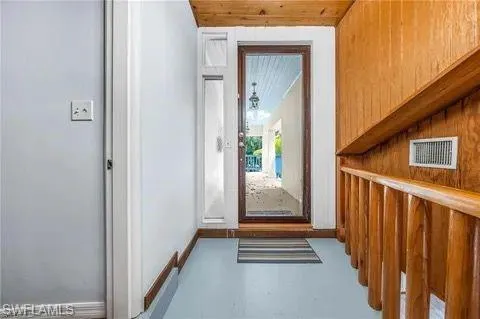 Entryway featuring finished concrete flooring