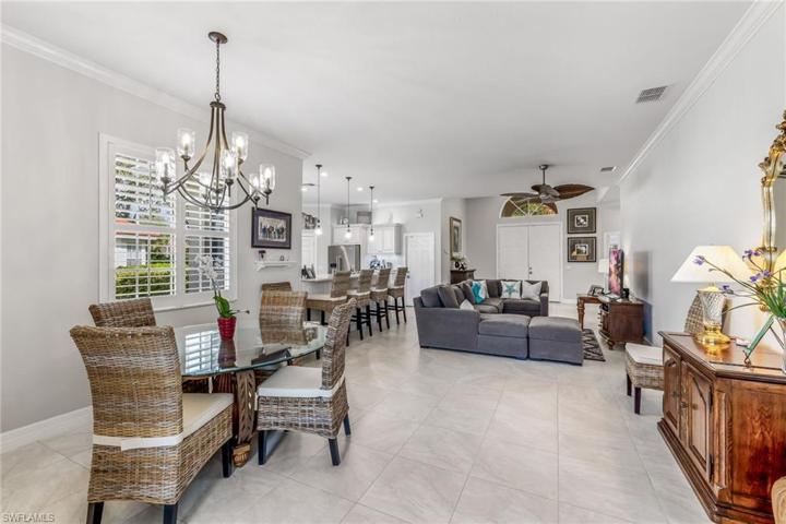 Dining Area with Living Area and Kitchen in background