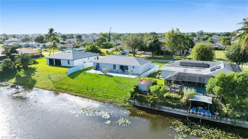 Aerial view of residential area with a nearby body of water