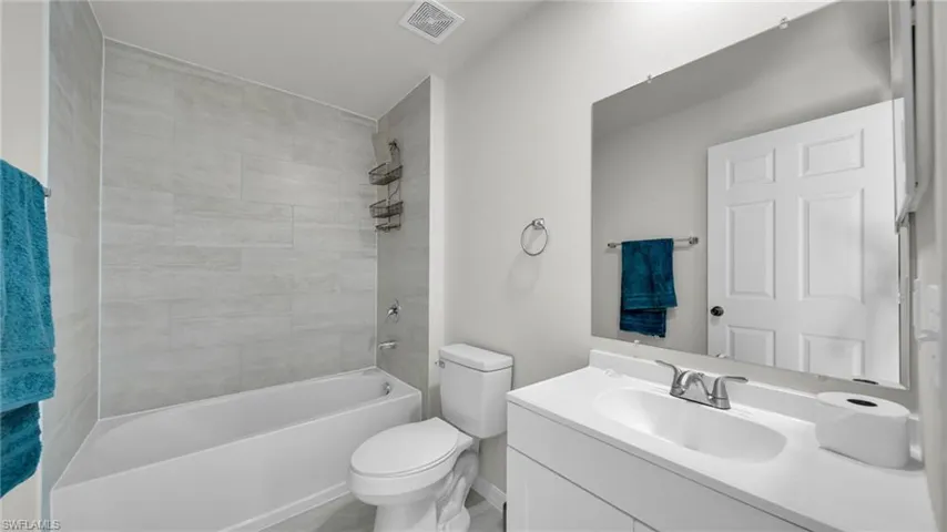 Full bathroom with shower / bathtub combination and vanity