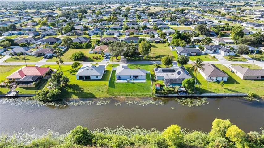 Aerial view of residential area with a nearby body of water