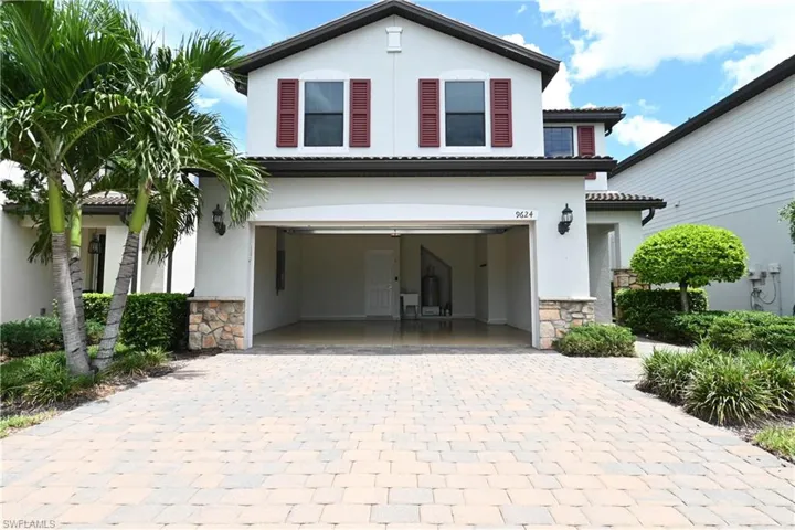 View of front of property with a carport
