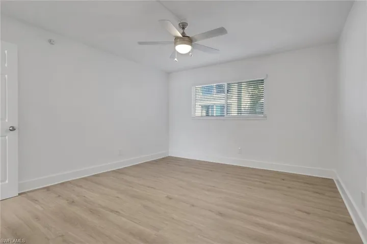 Spare room with light wood-style flooring and ceiling fan