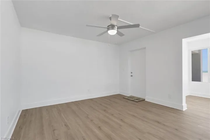 Spare room featuring light wood finished floors and a ceiling fan