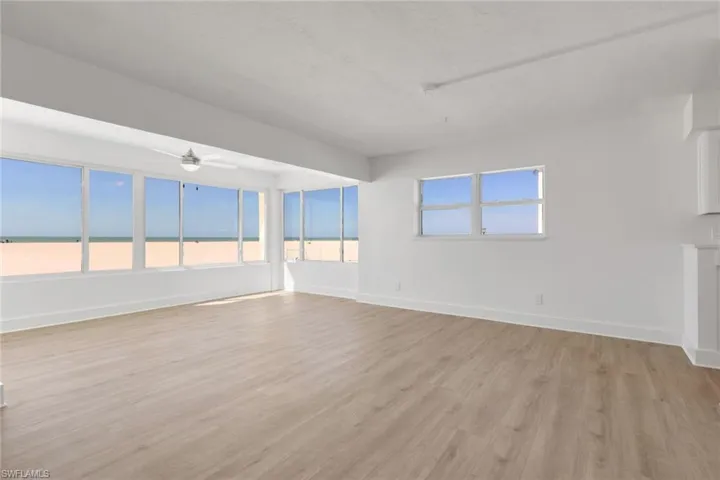 Spare room with light wood-type flooring and a ceiling fan