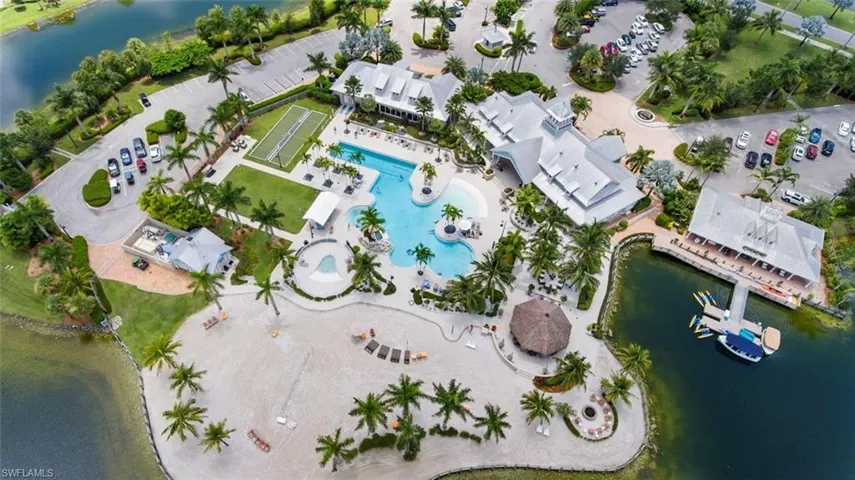 Birds eye view of property with a water view