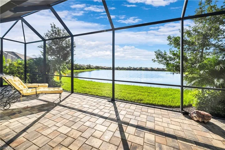 Unfurnished sunroom with a water view