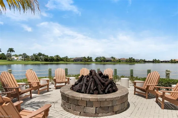 View of patio / terrace featuring a fire pit and a water view