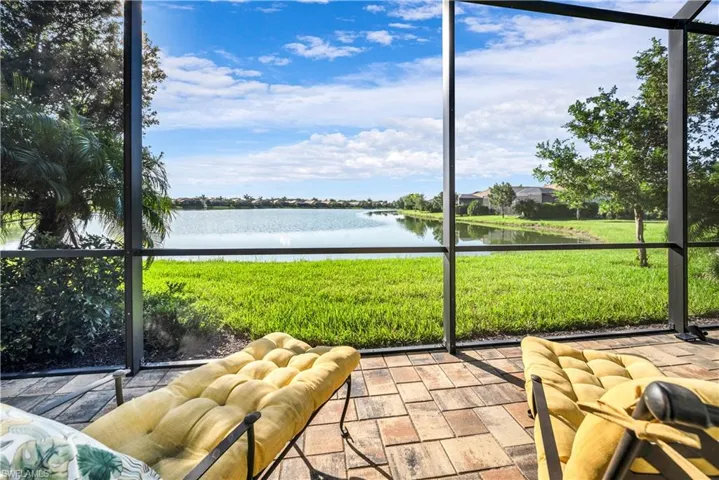 Unfurnished sunroom featuring a healthy amount of sunlight and a water view