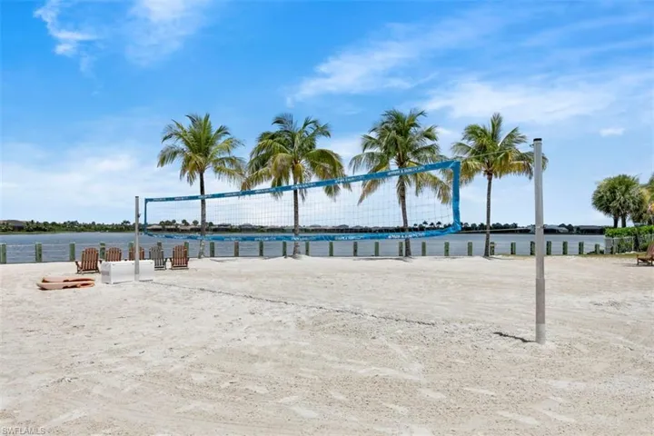 View of home's community featuring a water view and volleyball court