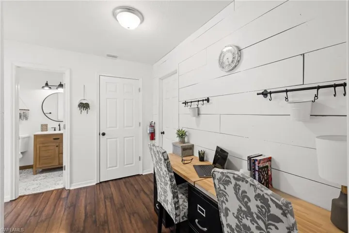 Office space featuring dark hardwood / wood-style flooring