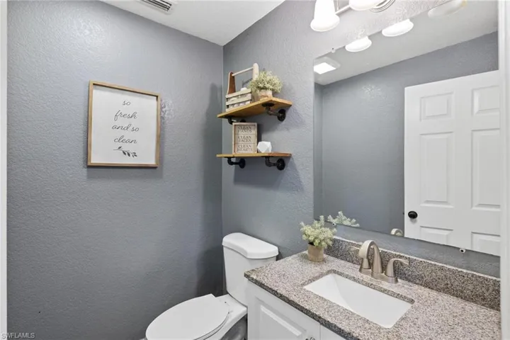 Bathroom with vanity and toilet