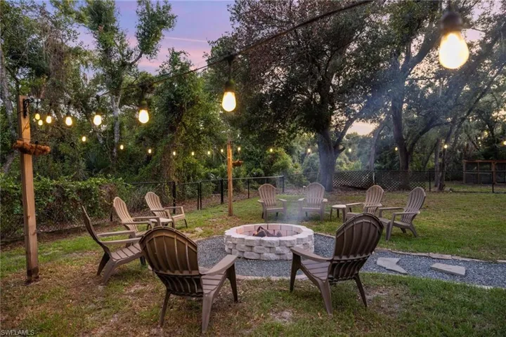 Yard at dusk with an outdoor fire pit