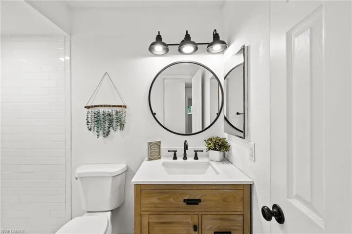 Bathroom featuring vanity and toilet