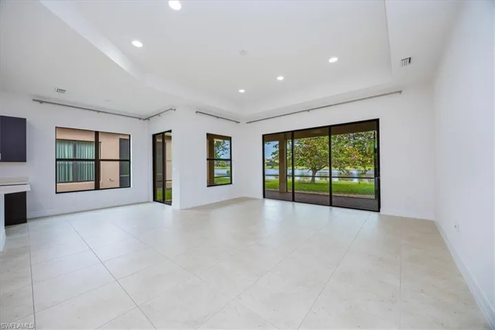 Spare room featuring a tray ceiling