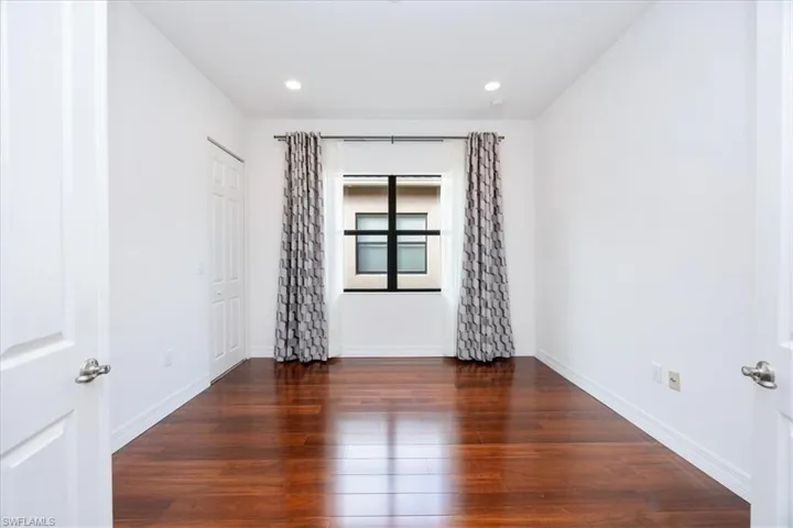 Spare room featuring dark hardwood / wood-style floors