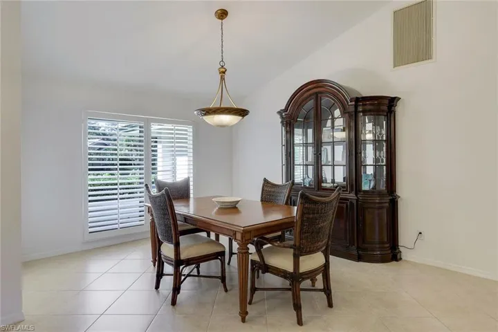 Tiled dining area located to left of entry and across of living room
