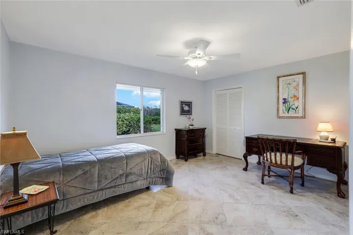 Bedroom with walk-in closet