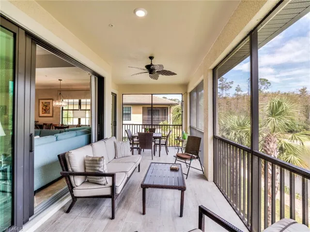 Sunroom / solarium featuring ceiling fan