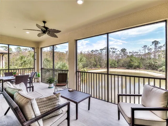 Sunroom / solarium featuring a healthy amount of sunlight and ceiling fan