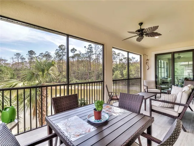 Sunroom / solarium featuring ceiling fan