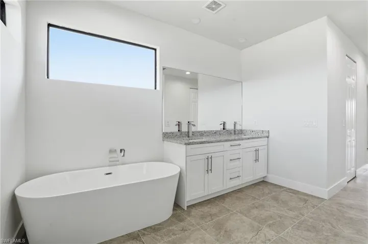 Bathroom with a soaking tub and double vanity