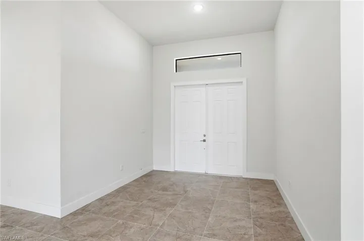 Entrance foyer featuring baseboards
