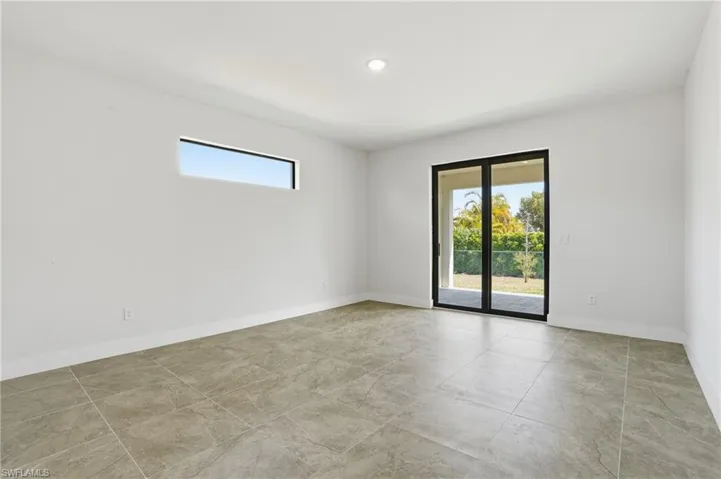 Spare room featuring baseboards