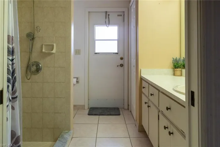 Full bath that opens to the pool area