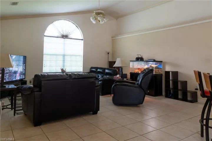 Family room with crown molding and ledges