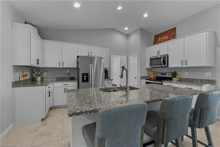 Another view of the large kitchen and island sitting area
