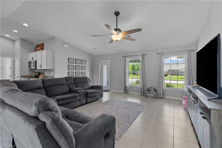 Another view of the HUGE living room towards the front door and open kitchen