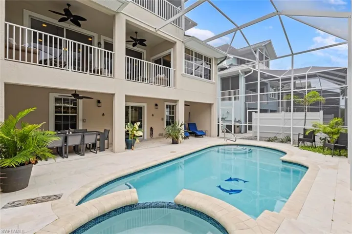 Large 2 story screen enclosure with a heated pool and spa.