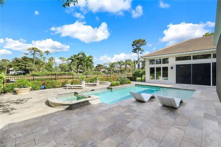 View of pool featuring a patio area and an in ground hot tub