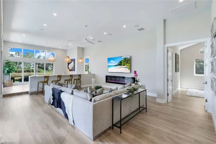 Living room with light hardwood / wood-style flooring